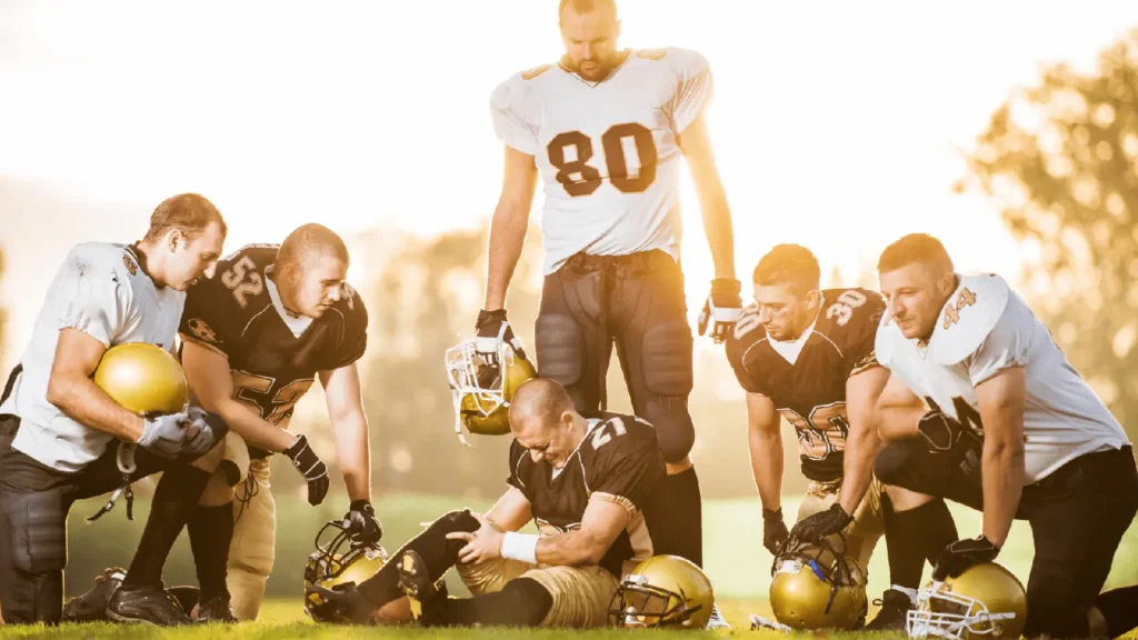 Football players practicing with a focus on injury prevention