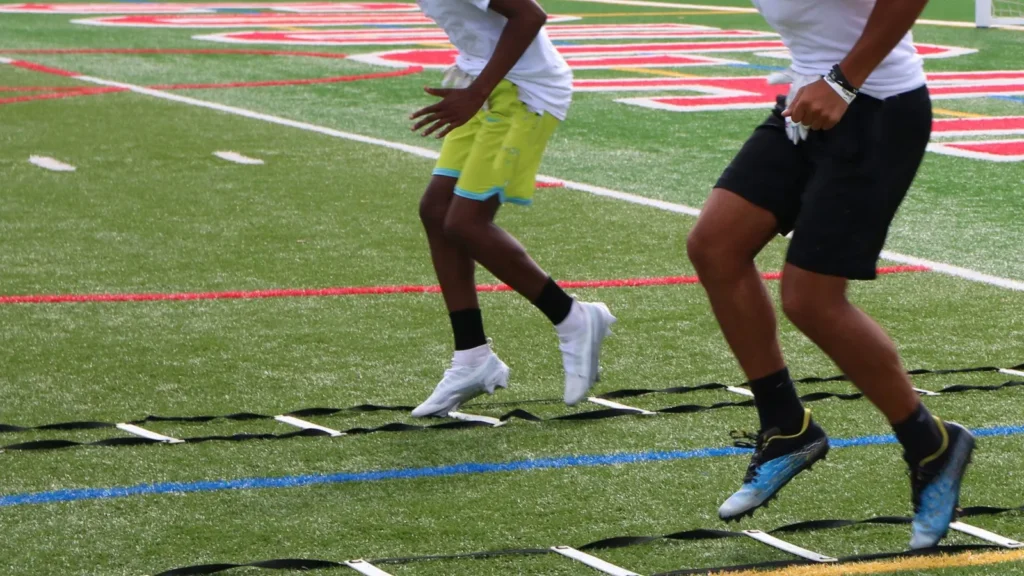 Two athletes performing agility drills for sports medicine performance training